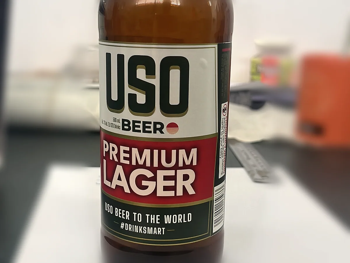 USO Premium Lager beer bottle with custom printed label